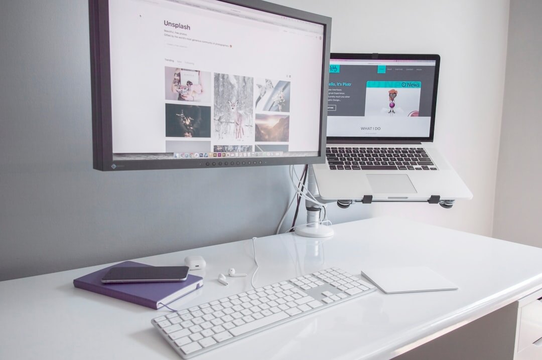 Minimalist developer desk setup with laptop and notebook