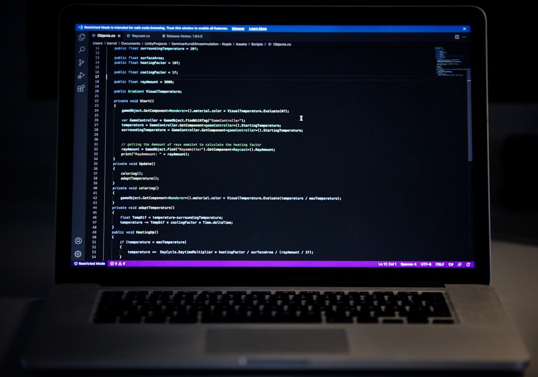 laptop with code on screen